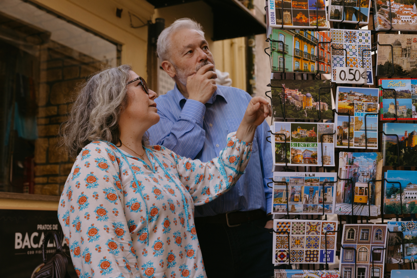 tourists exploring Sintra streets and buying postcards